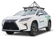 Photograph of white Hexagon-branded Lexus for a sensor mounted on a roof rack